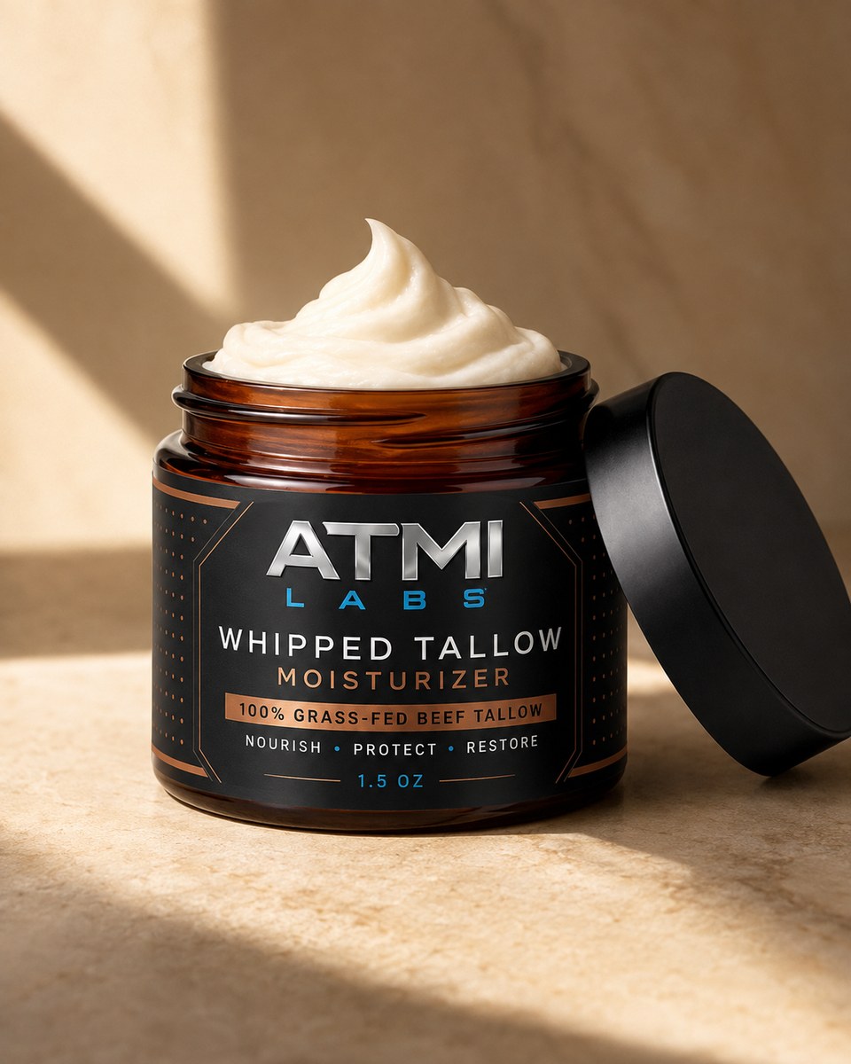 ATMI Labs Whipped 100% Grass-Fed Beef Tallow Moisturizer in an amber glass jar with a black lid